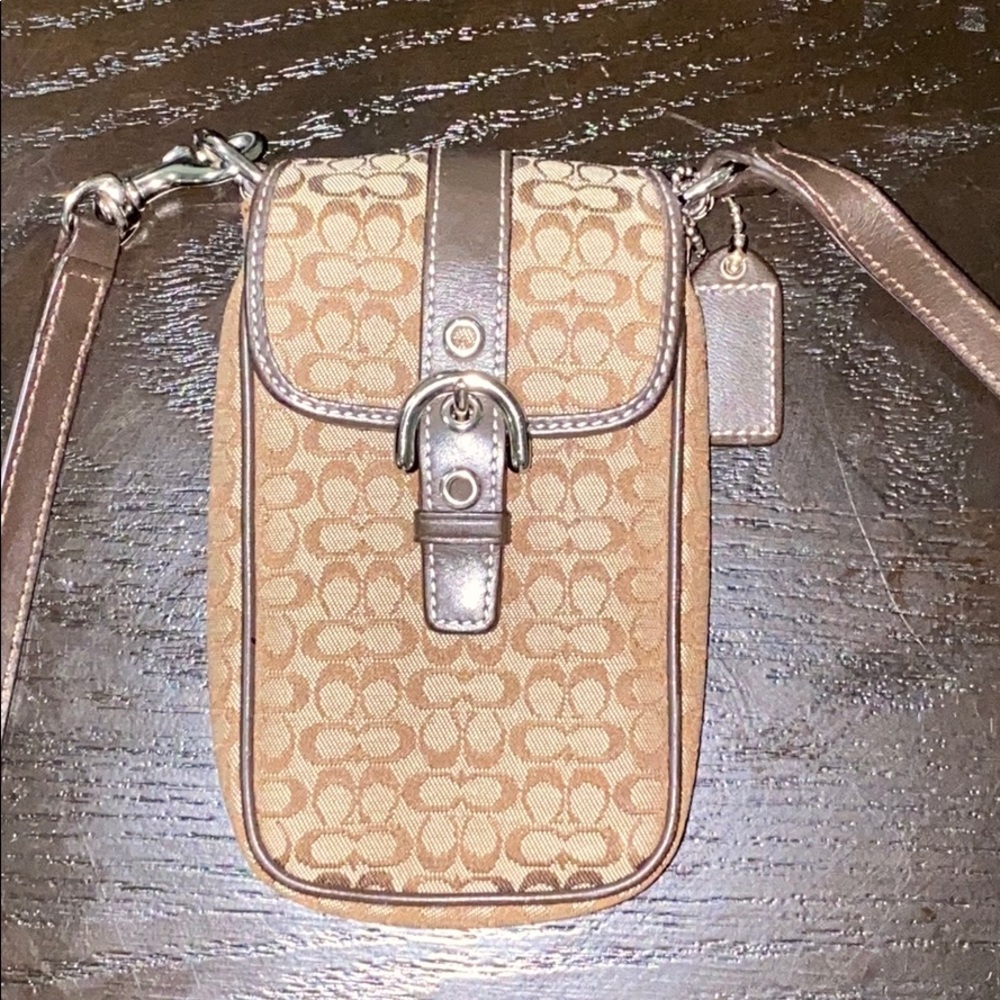 Coach designer phone-case bag with card holder.